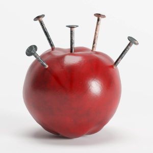 An apple with iron nails