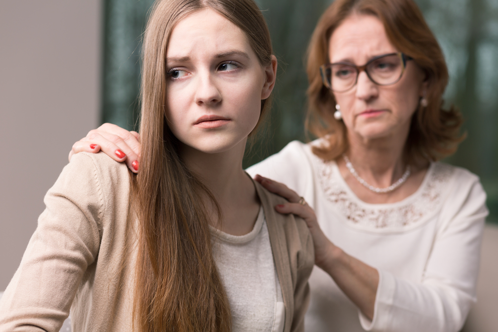 A worried teenager and her mother