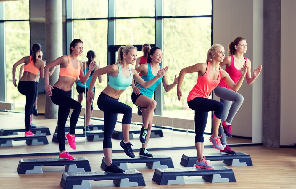 Women at a step aerobics class